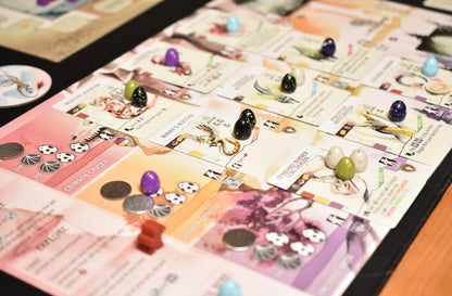 Image of components in the Wyrmspan board game